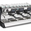 This image is a front-side view of the Rancilio Classe 7 3 group espresso machine in Anthracite Black, with traditional brew group height and USB volumetric dosing controls.